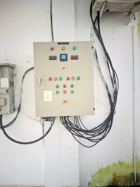 white wall ATS electrical panel, lots of black wires